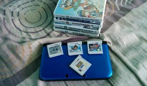 Nintendo 3ds Xl + 4 games Complete With Freebies photo